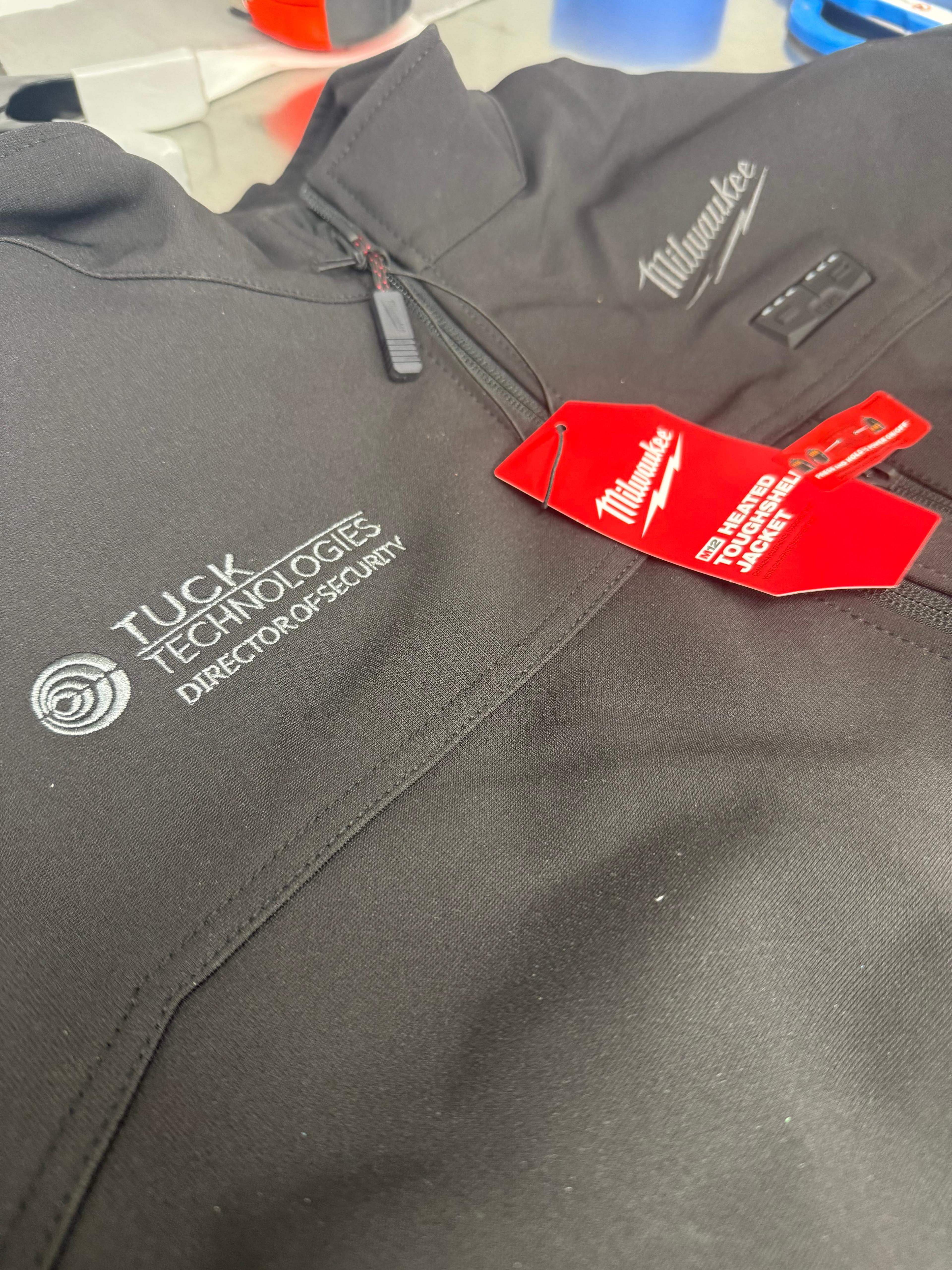 Corporate team wearing custom embroidered apparel